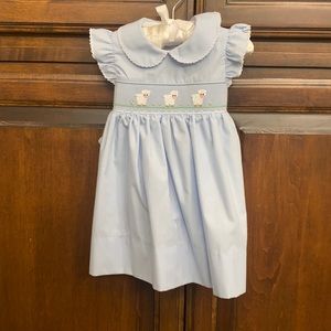 Light blue smocked dress. 9 months old. Only worn once